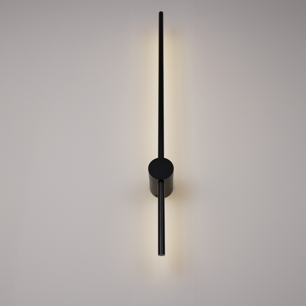 The Nordic Light Stick • 2-Pack by XCEPTION features a minimalist wall clock design, with sleek black hands against a light gray backdrop, creating a subtle shadow. The modern aesthetic highlights simplicity and elegance.