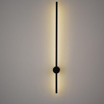 Introducing the Nordic Light Stick • 2-Pack by XCEPTION: A sleek, wall-mounted lamp featuring a delicate vertical black line and a circular base, designed to cast a gentle, warm glow against any simple backdrop.