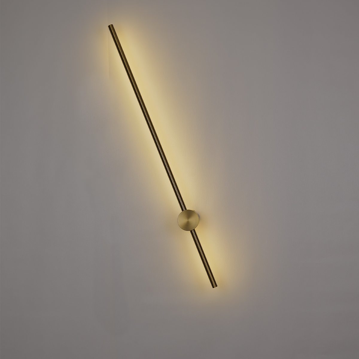 The Nordic Light Stick • 2-Pack by XCEPTION is a contemporary wall light fixture that showcases a sleek, horizontal rod casting a gentle, warm yellow glow. This elegant rod intersects with a circular base mounted on a plain wall, creating an understated and sophisticated lighting ambiance.
