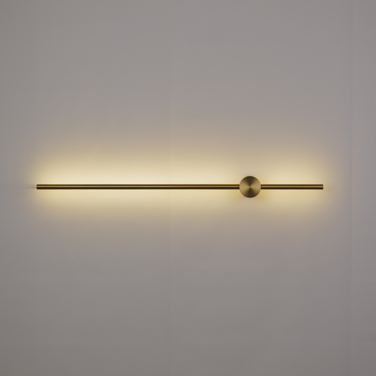 Introducing the Nordic Light Stick • 2-Pack by XCEPTION: This elegant wall light fixture showcases a sleek horizontal design with a spherical accent near the right end, casting a gentle, warm glow against any plain surface.