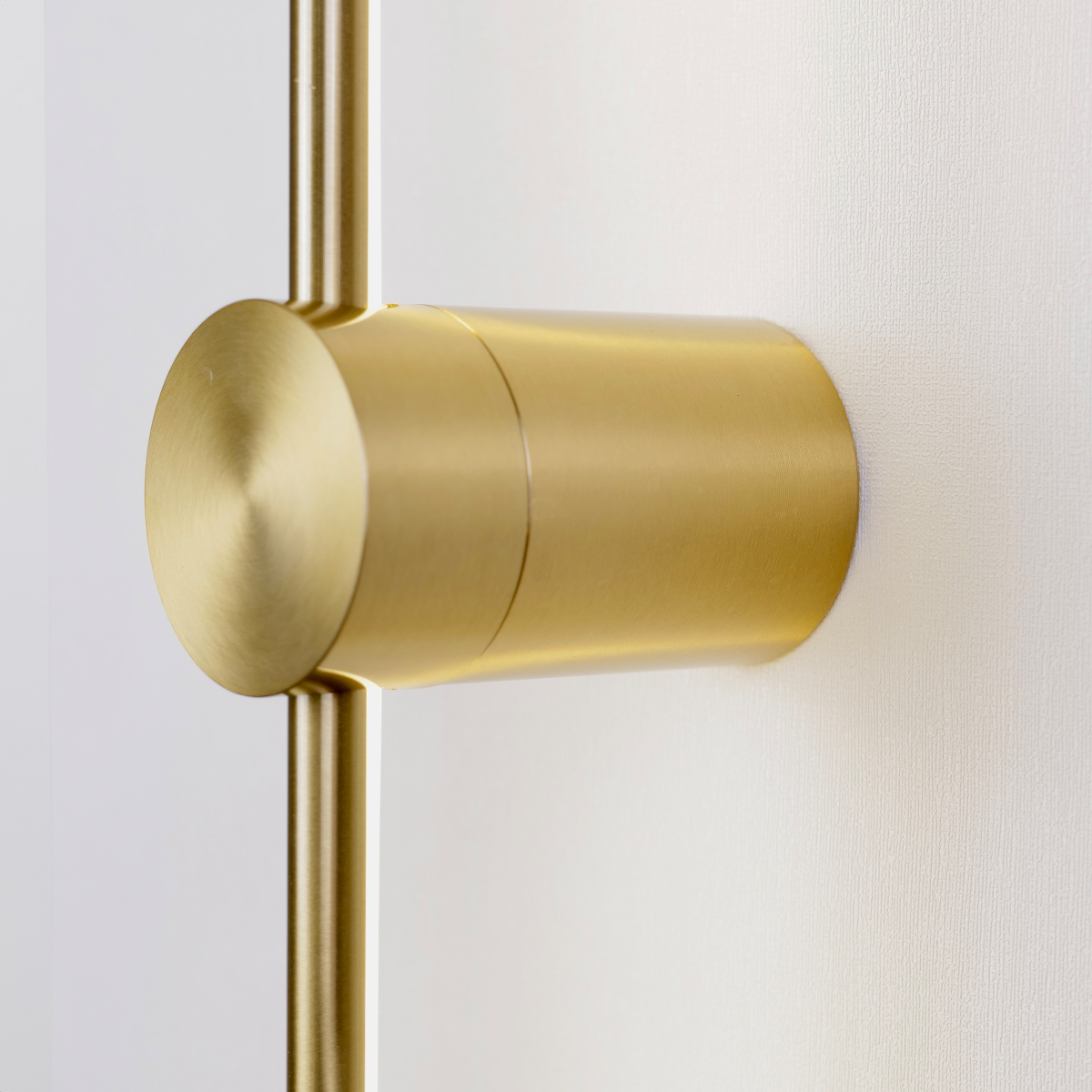 Close-up of a sleek, gold Nordic Light Stick door handle from XCEPTION against a white background. The handle features a brushed metal texture with a modern and minimalist design, offering a luxurious and contemporary feel.