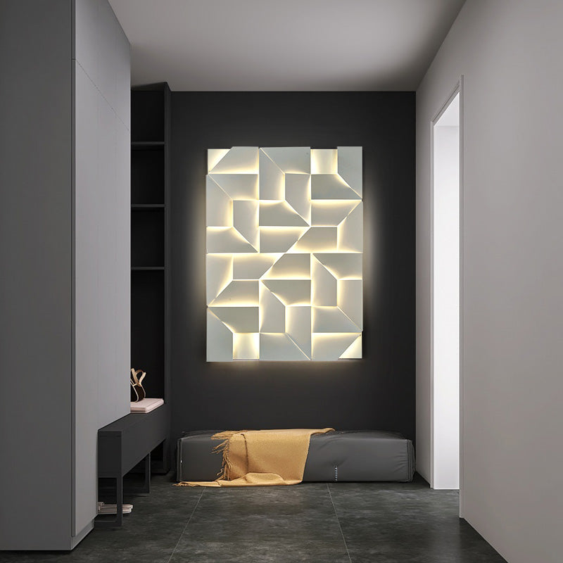 A contemporary hallway showcases XCEPTION's Geometric modern wall lights, offering adjustable color temperatures. The dark wall accentuates the setup, and the gray-tiled floor provides a complementary base. Warmth is introduced with a bench holding a folded yellow blanket, while an eye protection feature ensures comfort in this minimalist environment.
